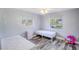 Bright ' bedroom with twin beds, stylish flooring, and natural light from the backyard view at 2005 Dalton Ave, Deltona, FL 32725