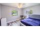 Comfortable bedroom with stylish flooring, natural light, and modern ceiling fan at 2005 Dalton Ave, Deltona, FL 32725