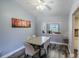 Bright dining room with modern table, gray walls, stylish floors, and backyard view at 2005 Dalton Ave, Deltona, FL 32725