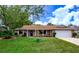 Charming brick home with a well-manicured lawn and a welcoming front entrance at 2005 Dalton Ave, Deltona, FL 32725
