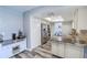 Modern kitchen features stainless steel appliances, granite countertops, and ample cabinet space at 2005 Dalton Ave, Deltona, FL 32725