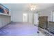 Spacious primary bedroom featuring a large bed, dresser, and ensuite bathroom access at 2005 Dalton Ave, Deltona, FL 32725
