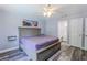 Cozy primary bedroom features a spacious layout, bathroom access, and stylish grey flooring at 2005 Dalton Ave, Deltona, FL 32725