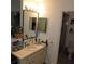 Bathroom with vanity with sink, mirror and view to the toilet and shower stall at 2480 Tahoe Cir # 2480, Winter Park, FL 32792