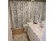 Bright bathroom featuring a shower with floral curtain, and a vanity at 2480 Tahoe Cir # 2480, Winter Park, FL 32792