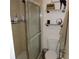 Shower stall, toilet and shelves in the bathroom at 2480 Tahoe Cir # 2480, Winter Park, FL 32792