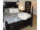 Comfortable bedroom featuring a large bed, side table with lamp, and a bookshelf at 2480 Tahoe Cir # 2480, Winter Park, FL 32792