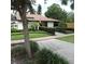 Well-manicured landscaping surrounds the community clubhouse, enhancing curb appeal at 2480 Tahoe Cir # 2480, Winter Park, FL 32792