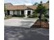 Charming single-story home featuring a well-maintained lawn and a two-car driveway at 2480 Tahoe Cir # 2480, Winter Park, FL 32792