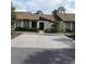 Charming single-story home featuring a well-maintained lawn and a two-car driveway at 2480 Tahoe Cir # 2480, Winter Park, FL 32792