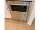 Kitchen with stainless steel dishwasher and light wood flooring at 2480 Tahoe Cir # 2480, Winter Park, FL 32792