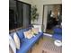 Stylish outdoor seating area with comfortable cushions and view of the living room at 2480 Tahoe Cir # 2480, Winter Park, FL 32792