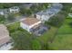 Aerial view of the home and yard shows the screened-in pool and green lawn at 2507 Water Valley Dr, St Cloud, FL 34771