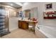 This bathroom showcases a tub, shower, vanity with wooden cabinets, and tiled floors at 2507 Water Valley Dr, St Cloud, FL 34771