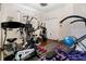Home gym with a variety of exercise equipment and hardwood floors at 2507 Water Valley Dr, St Cloud, FL 34771