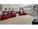 Spacious home theater with comfortable seating, projector screen, and stylish decor at 2507 Water Valley Dr, St Cloud, FL 34771