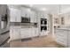 Modern kitchen with stainless steel appliances, tile backsplash, and ample cabinet space at 2507 Water Valley Dr, St Cloud, FL 34771