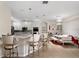 Eat-in kitchen featuring modern island seating and stainless steel appliances at 2507 Water Valley Dr, St Cloud, FL 34771