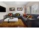 Stylish living room featuring hardwood floors, modern decor, and plantation shutters at 2507 Water Valley Dr, St Cloud, FL 34771