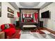 Bedroom with a canopy bed, and red and black accents at 2507 Water Valley Dr, St Cloud, FL 34771