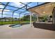 Outdoor patio with screened-in pool area, lounging furniture, and overhead lighting at 2507 Water Valley Dr, St Cloud, FL 34771