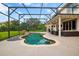 Relaxing screened-in pool has stone detail and a grassy yard at 2507 Water Valley Dr, St Cloud, FL 34771