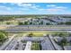 Aerial view overlooking community, roadways and nearby lake at 2791 L B Mcleod Rd # C, Orlando, FL 32805