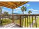 Balcony with wooden railing offering views of the community and palm trees at 2791 L B Mcleod Rd # C, Orlando, FL 32805