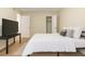 Relaxing bedroom with a bed, TV, and open closet, creating a comfortable space to unwind at 2791 L B Mcleod Rd # C, Orlando, FL 32805