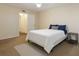 Inviting bedroom with carpet, a queen-sized bed, and a doorway to an attached bathroom at 2791 L B Mcleod Rd # C, Orlando, FL 32805