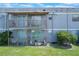Exterior shot of the two story building featuring balconies and lawn at 2791 L B Mcleod Rd # C, Orlando, FL 32805