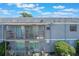 Exterior shot of the two story building featuring balconies and lawn at 2791 L B Mcleod Rd # C, Orlando, FL 32805