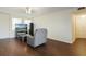 Bright living room with wood floors, a comfortable recliner, and natural light from the windows at 2791 L B Mcleod Rd # C, Orlando, FL 32805