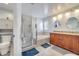 Well-lit bathroom boasts a double vanity, walk-in shower and separate tub at 280 Bay St, Apopka, FL 32712