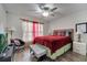 Comfortable bedroom features a window, accent lamps, a ceiling fan and chair at 280 Bay St, Apopka, FL 32712