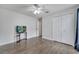 This bedroom has hardwood floors, a closet, and an exterior door at 280 Bay St, Apopka, FL 32712