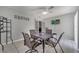 Bright dining area featuring tile floors, a ceiling fan, and a square dining table for four at 280 Bay St, Apopka, FL 32712