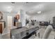 Open-concept dining area with modern lighting fixtures and view of the open living area at 280 Bay St, Apopka, FL 32712