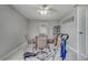 The exercise room includes equipment, a dining table, and tile floors at 280 Bay St, Apopka, FL 32712
