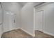 Bright foyer with wood-look floors, closet, and front door at 280 Bay St, Apopka, FL 32712