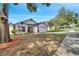 Charming single-story home with a well-manicured lawn and colorful landscaping at 280 Bay St, Apopka, FL 32712