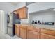 Kitchen with granite countertops, and stainless steel appliances offers an open layout into the living area at 280 Bay St, Apopka, FL 32712