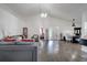 Open living space featuring vaulted ceilings, wood floors, and view to a dining and bedroom area at 280 Bay St, Apopka, FL 32712