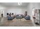 Bright living room with ample seating, and wood floors, creating an inviting atmosphere at 280 Bay St, Apopka, FL 32712