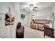 Bedroom with a bunk bed, soft carpet flooring, and a ceiling fan at 2820 Oakwater Dr # 2820, Kissimmee, FL 34747