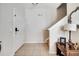 Entryway with a white front door, tile flooring, and staircase to the upper level at 2820 Oakwater Dr # 2820, Kissimmee, FL 34747