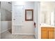 Upstairs hallway with a view into the bathroom featuring a sink and a shower at 2820 Oakwater Dr # 2820, Kissimmee, FL 34747