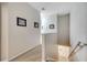 Upstairs hallway with carpet flooring, neutral walls, and decorative wall art at 2820 Oakwater Dr # 2820, Kissimmee, FL 34747