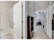 Hallway view into the bathroom and bedroom, showcasing the home's layout at 2820 Oakwater Dr # 2820, Kissimmee, FL 34747