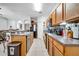 Kitchen with granite countertops, stainless steel appliances, and wood cabinets at 2820 Oakwater Dr # 2820, Kissimmee, FL 34747